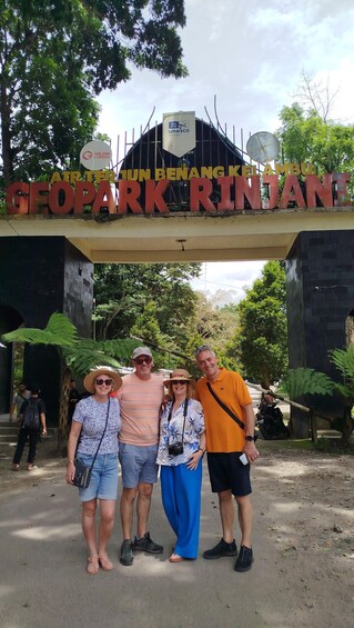 A group of people standing in front of a sign that reads 'GEOPARK RINJA'. 2