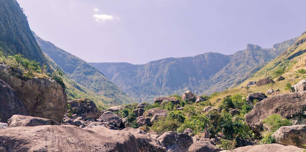 A mountainous landscape with rocky terrain and sparse vegetation. 2
