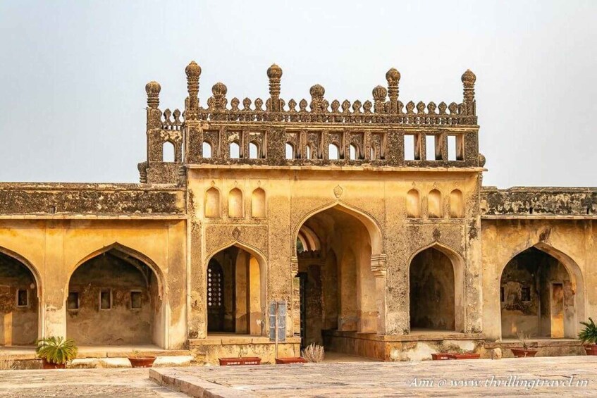 A historic building with ornate arches and a decorative roof. 4