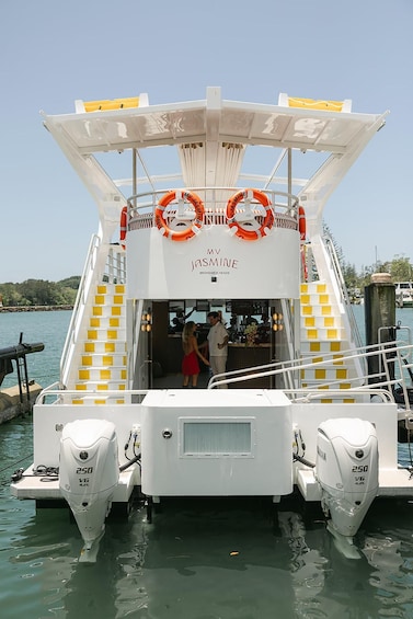 A boat named MV Jasmine at a dock. 2