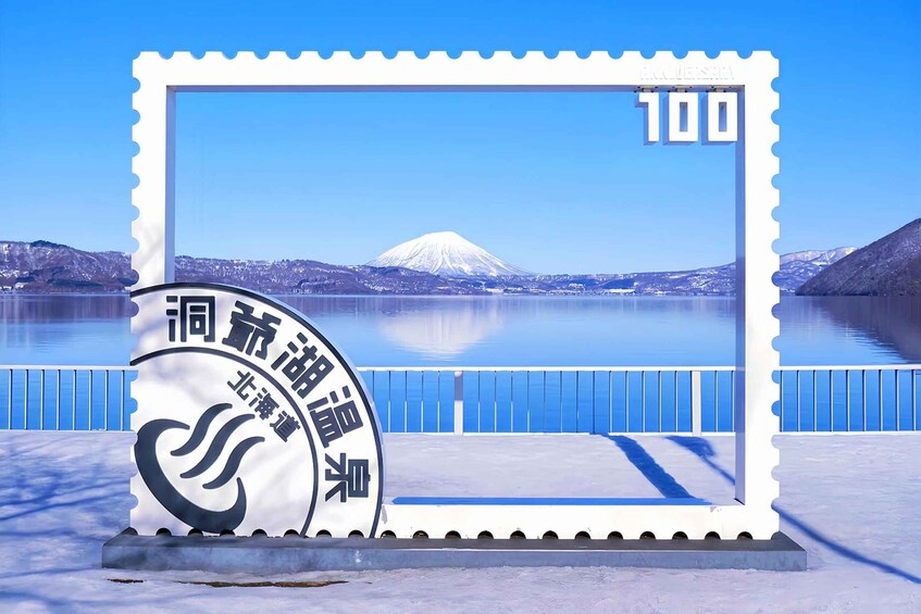 A postcard with a mountain and a lake. 2