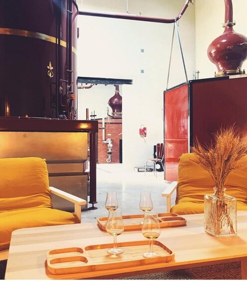 A modern interior with a wooden table, two yellow chairs, and a red lamp. 4