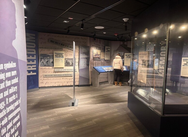 An indoor exhibit with historical displays and informational panels. 4