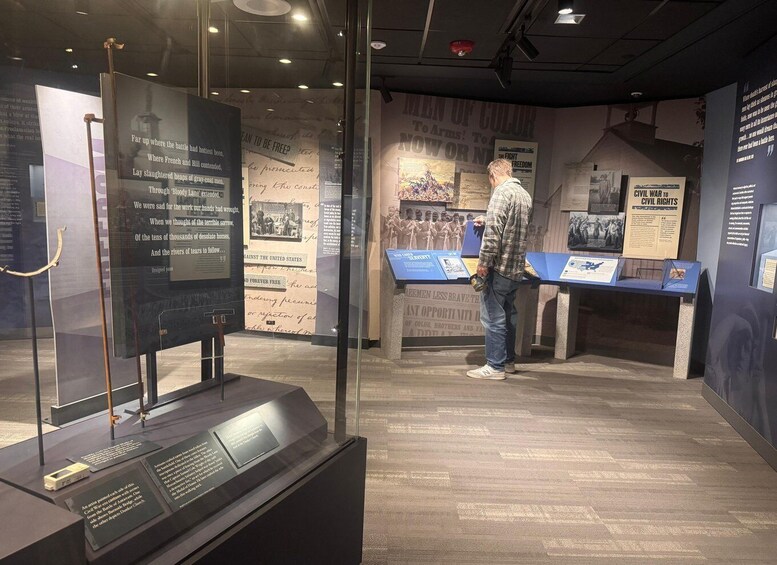 A museum exhibit with historical displays and informational plaques. 3