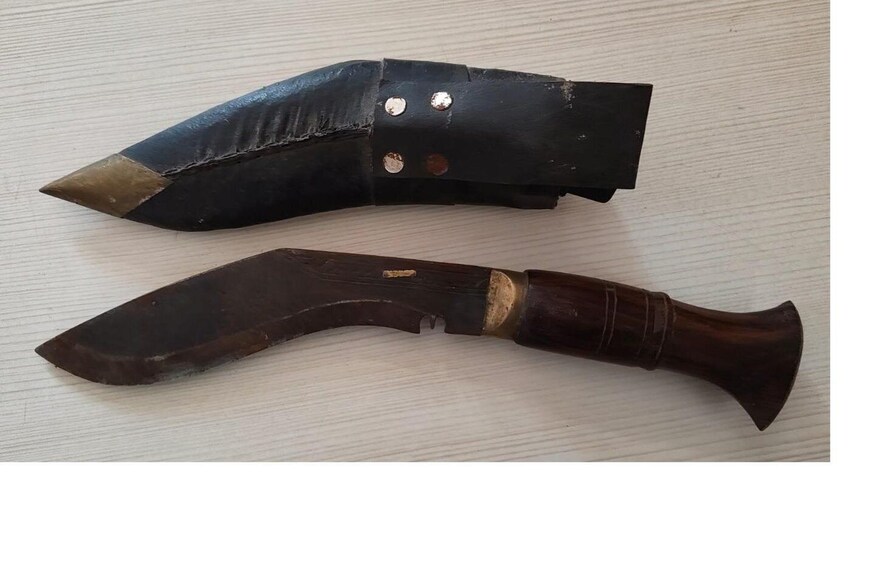 Two wooden tools with metal rivets and a dark finish. 4