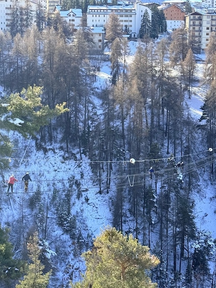 A snowy mountain landscape with trees and a ski lift. 5
