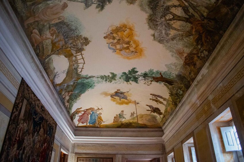 A classical ceiling fresco with mythological figures, architectural moldings, and a central tree. 2