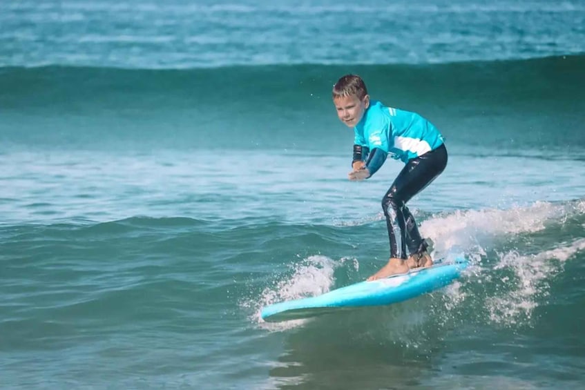 A person surfing on a wave in the ocean. 2