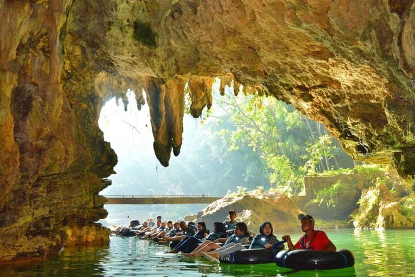 People rafting in a cave. 1