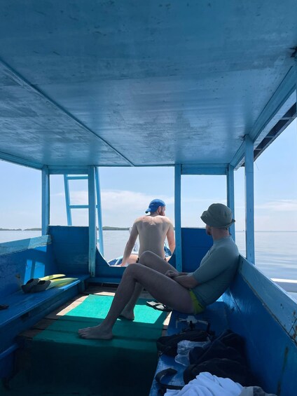 Two people on a boat with a view of the water. 5