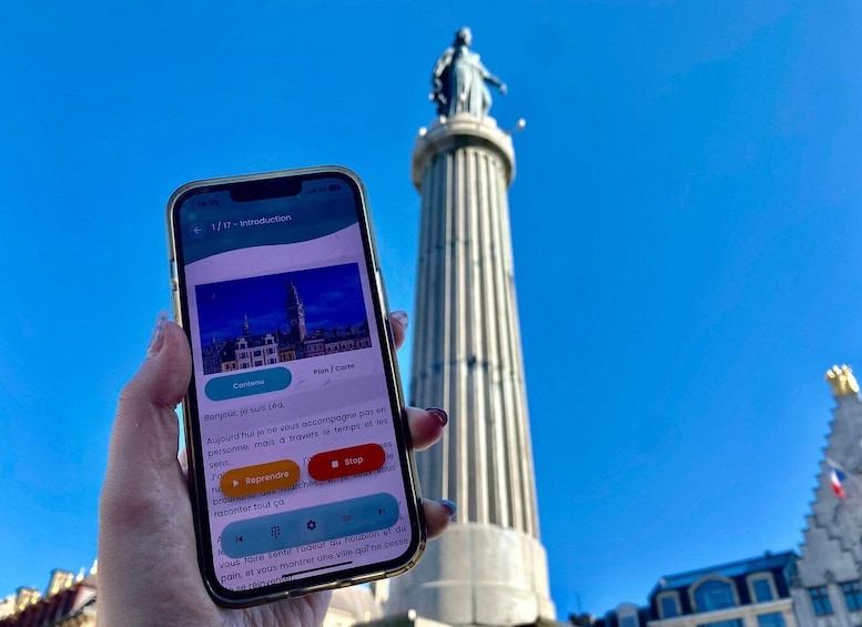 A smartphone displaying a map application with a tall, slender monument in the background. 4