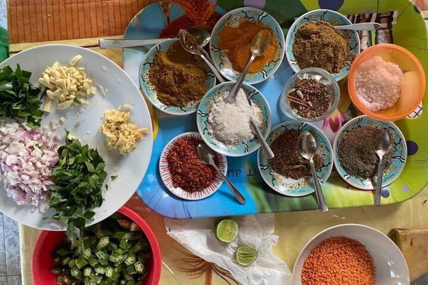 A variety of food ingredients and spices laid out on a table. 4