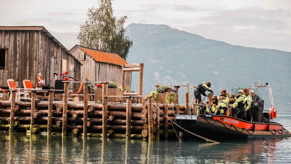 A wooden dock with a boat named '845 Diving' docked at the pier. 3
