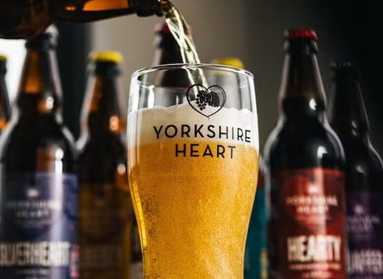 A glass of Yorkshire Heart beer being poured. 1