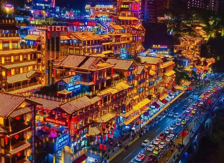 A densely packed urban street at night with traditional architecture and neon signs. 3
