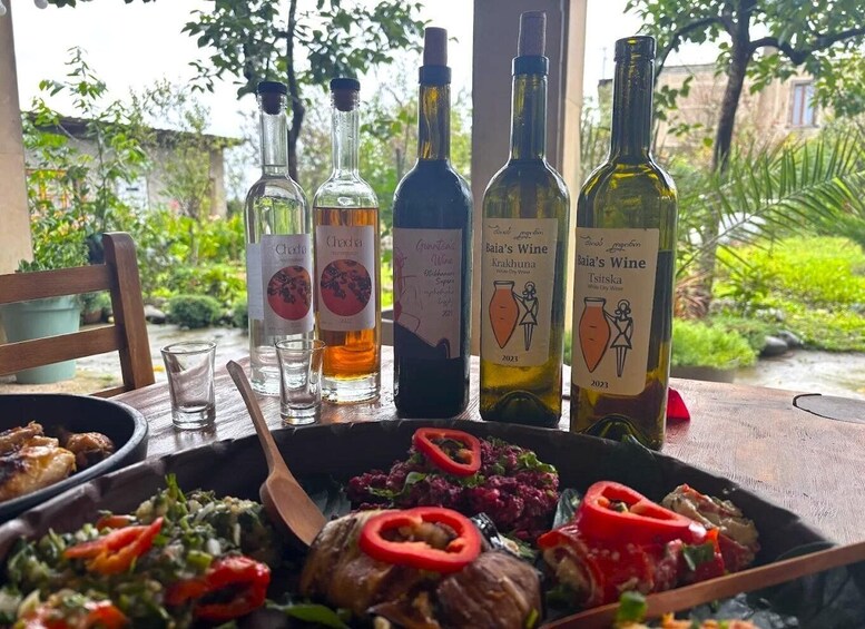 A table with food and wine bottles. 2