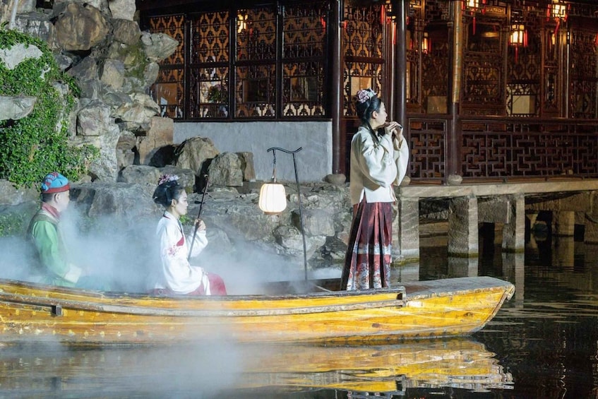 A traditional boat ride with people in historical attire. 4