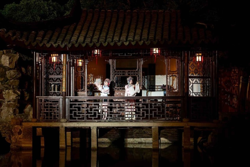 A traditional Chinese building with intricate wooden latticework and a tiled roof. 2