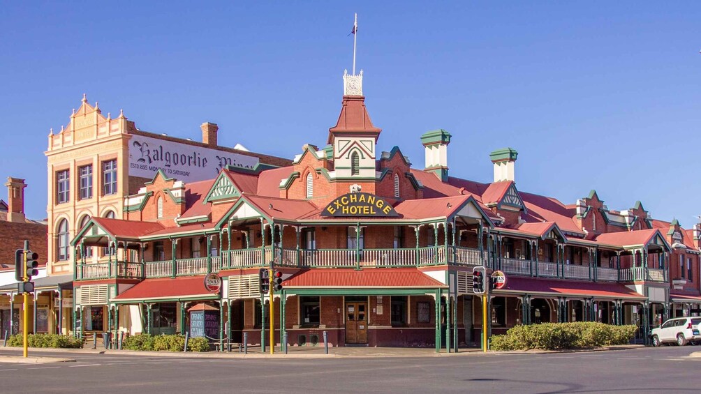 A historic building with a prominent sign for the Exchange Hotel. 2