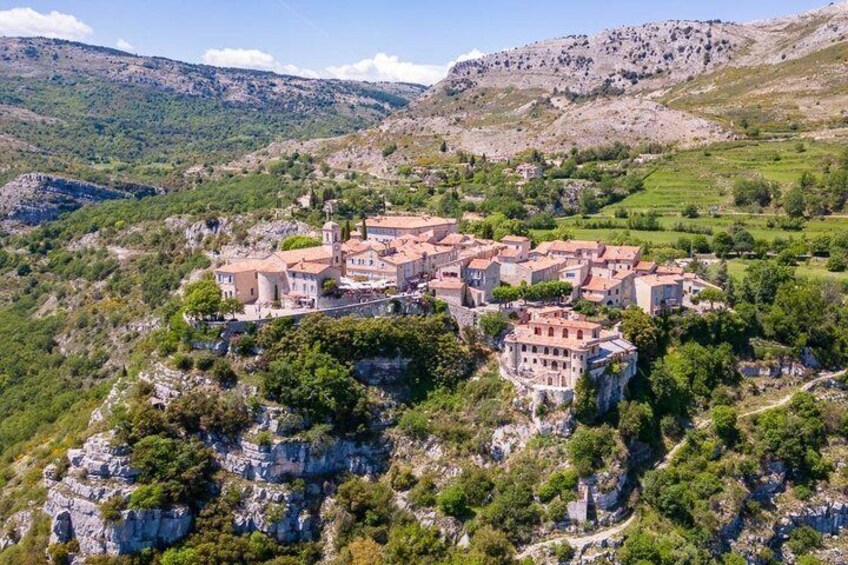 A village nestled in a mountainous area with terraced fields and traditional buildings. 2