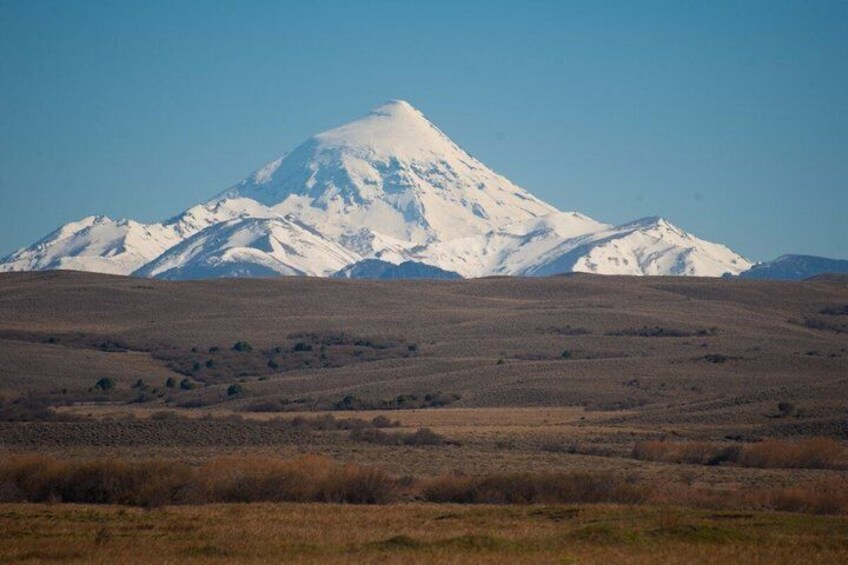 A snow-capped mountain with a clear sky. 2