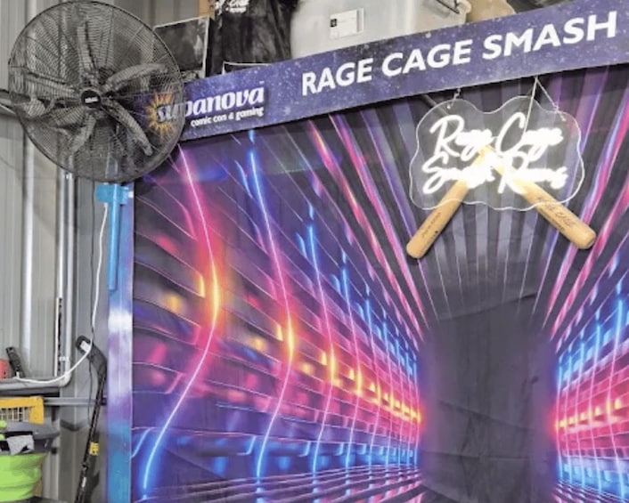 A neon-lit tunnel with a sign that reads 'RAGE CAGE SMASH' and a neon sign that says 'Royce's Sweet Shop.' 4