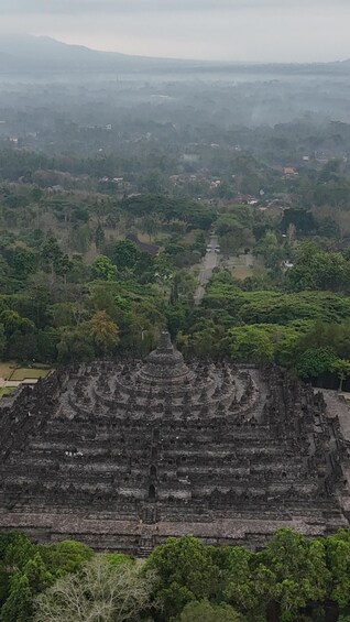 A temple complex surrounded by dense forest. 4