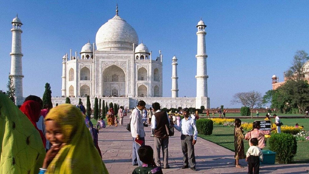 The Taj Mahal with visitors in the foreground. 3