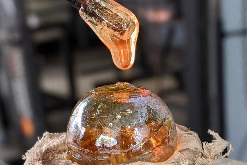 A glass sculpture on a burlap cloth. 3