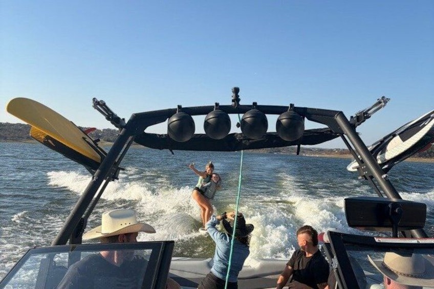 A wakeboarding activity on a boat with a wake. 1