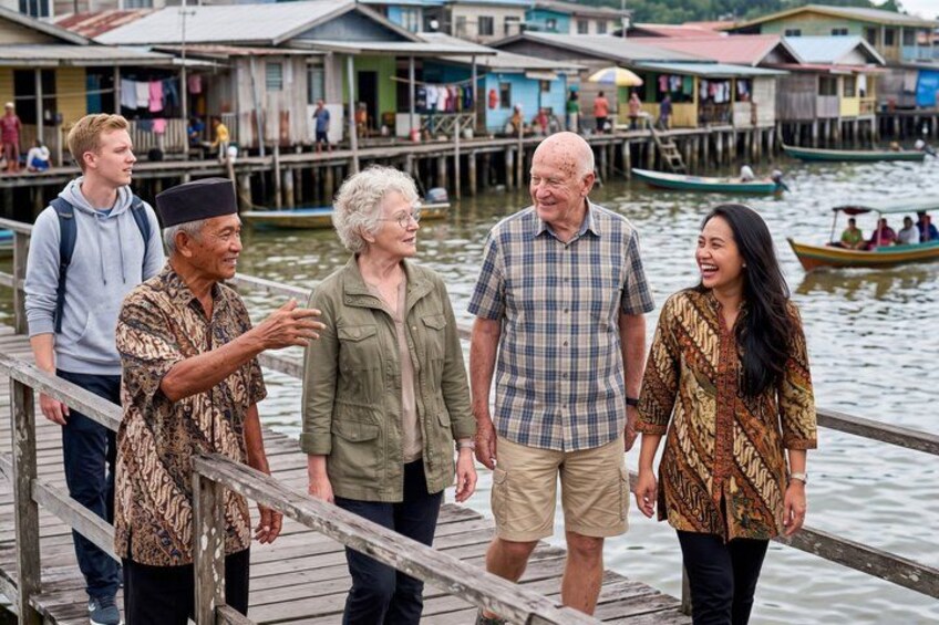 A group of people walking on a wooden dock with houses in the background. 4