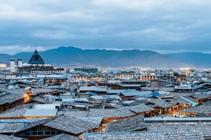 A cityscape with traditional buildings and a prominent pagoda. 4