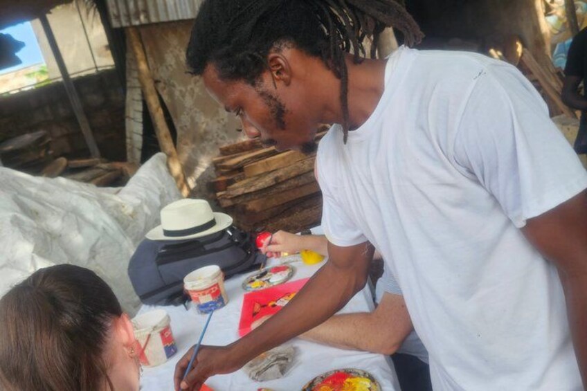 A person painting a portrait. 2