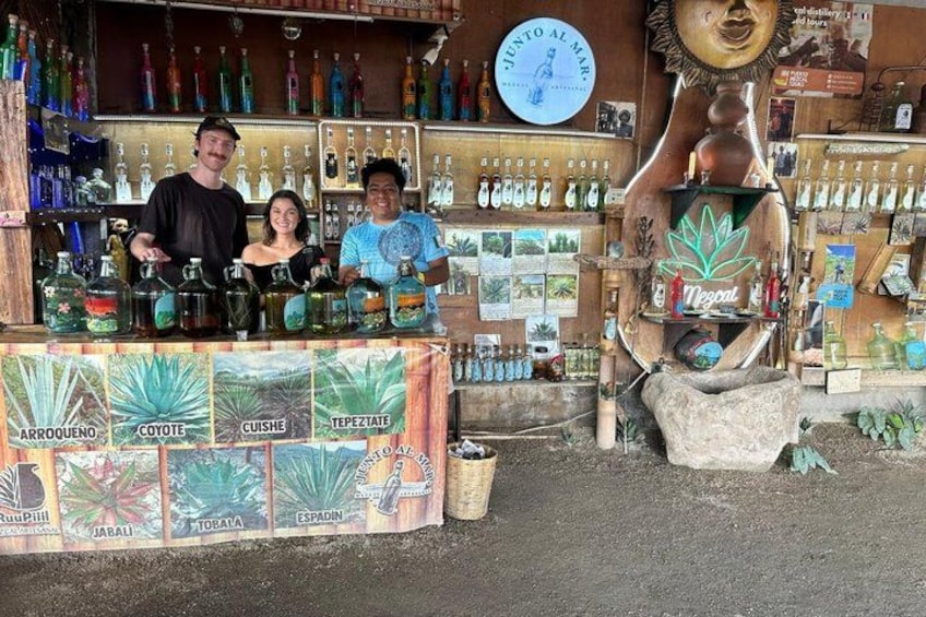 A bar with various bottles and a large decorative sculpture. 2