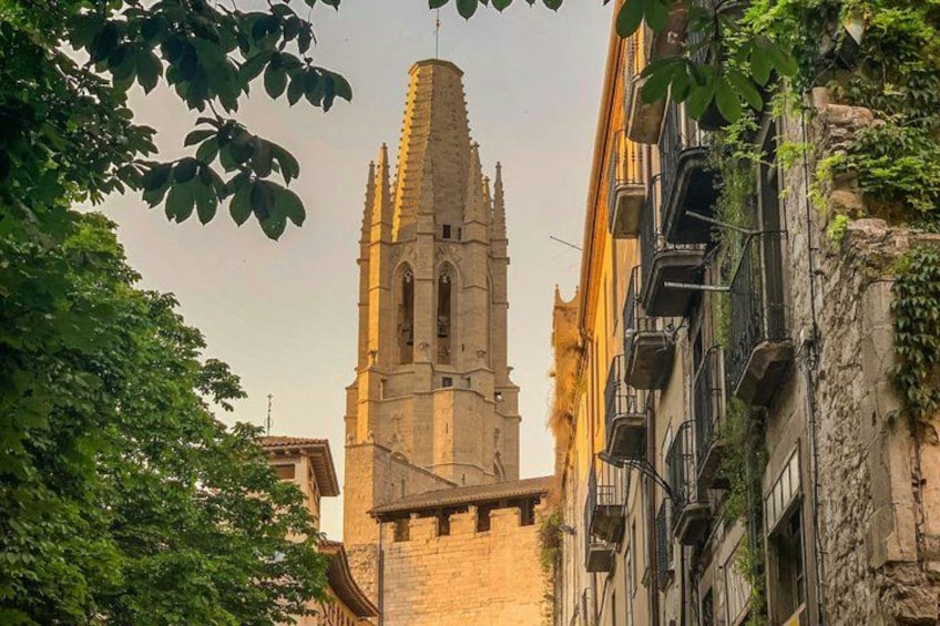 A historic church with a tall, pointed tower and a stone facade. 2