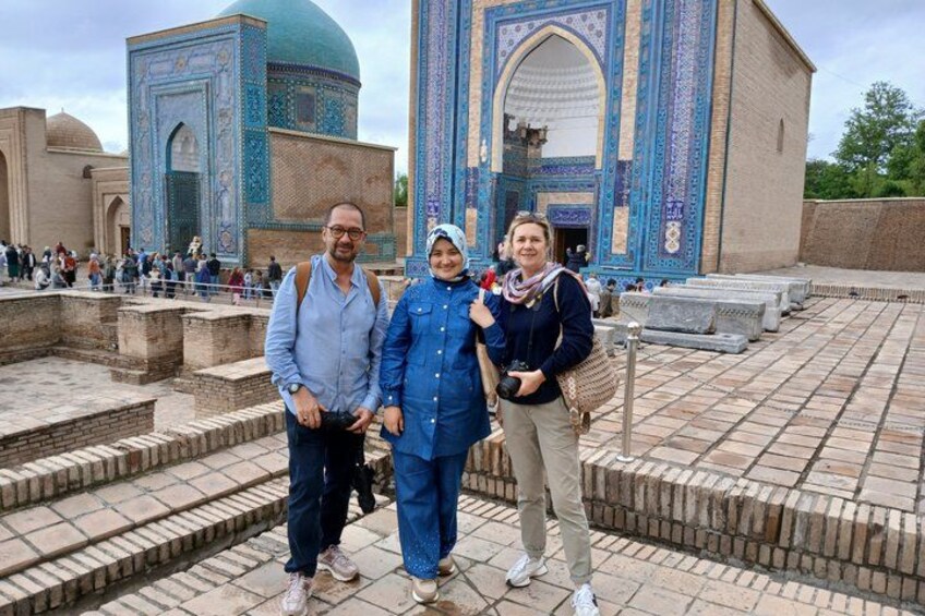 A historical building with intricate blue and white tile work, a dome, and a large arched entrance. 1