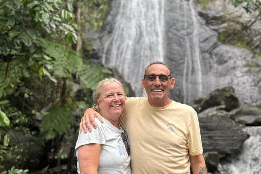 A waterfall with lush greenery in the background. 1