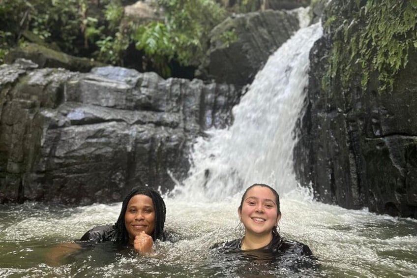Two people in a waterfall. 5