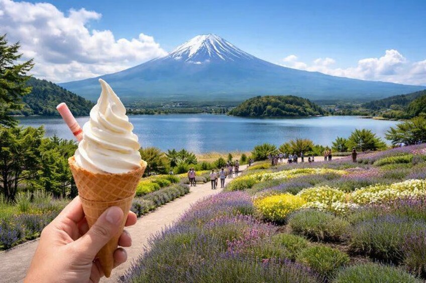 A hand holding an ice cream cone with a mountain and lake in the background. 3