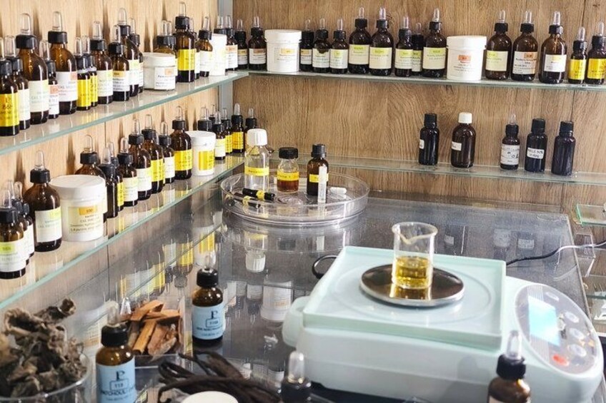 A variety of bottles and containers on shelves, likely in a laboratory or storage setting. 2