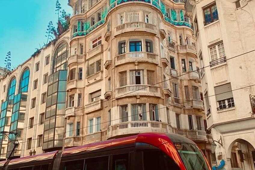 A historic building with ornate balconies and large windows. 3