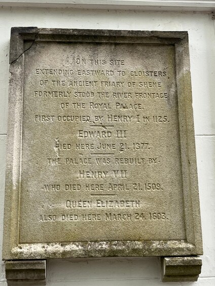 A stone monument with engraved historical information. 3
