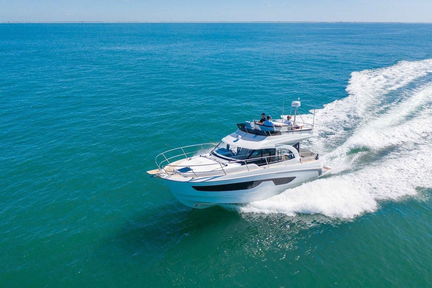 A white yacht cruising on turquoise waters. 2