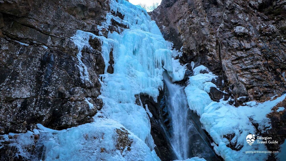 A frozen waterfall in a rocky gorge. 4