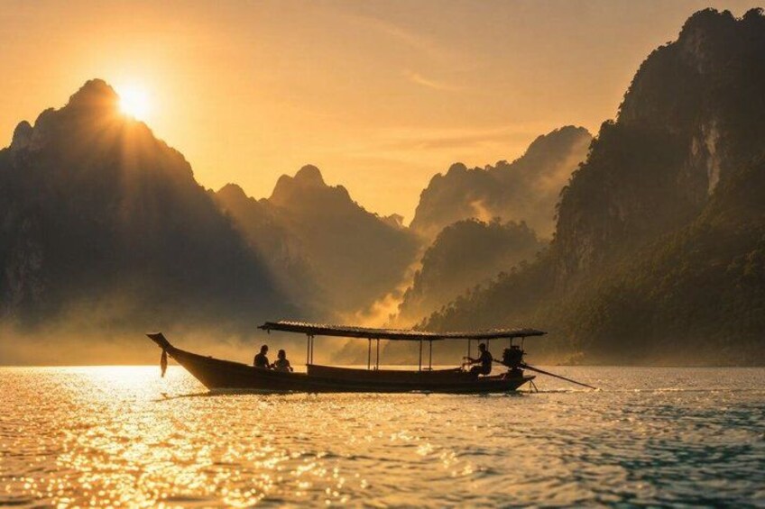 A traditional boat on calm water with a mountainous backdrop during sunrise or sunset. 3