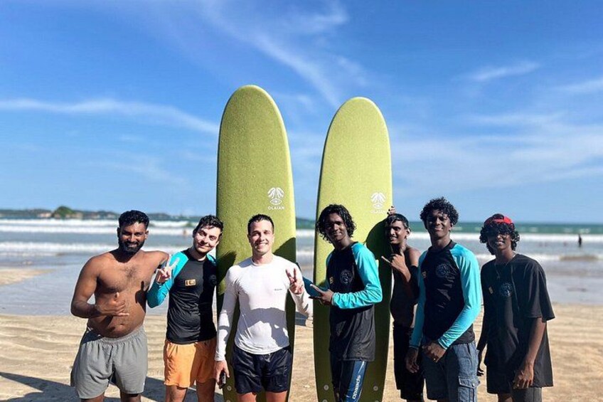 A group of people on a beach with surfboards. 5