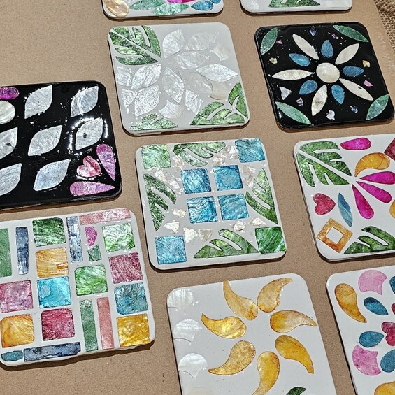 A collection of decorative tiles with various patterns and colors. 3