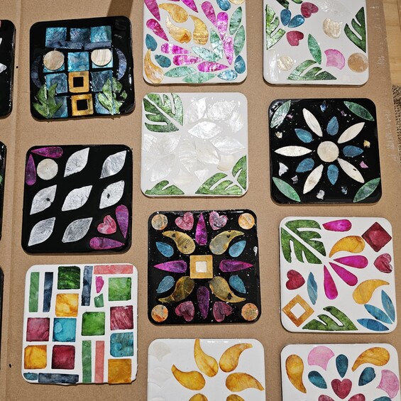 A collection of handmade decorative plates with various patterns and colors. 2