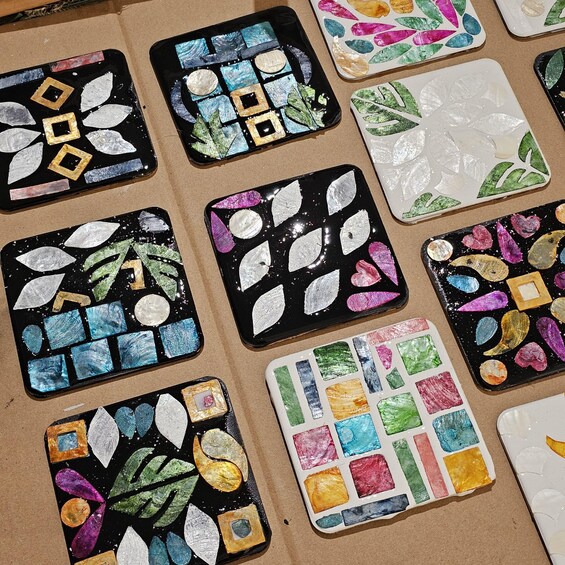 A collection of mosaic tiles with various shapes and colors. 5