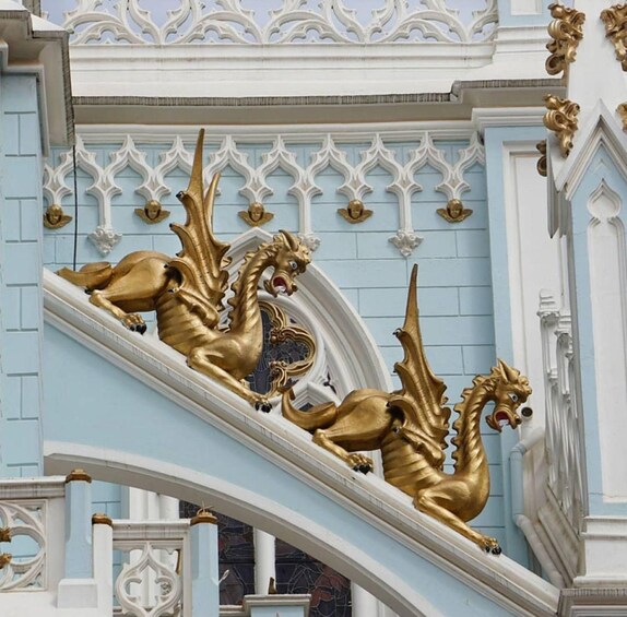 Ornate golden dragons on a white and blue staircase. 3